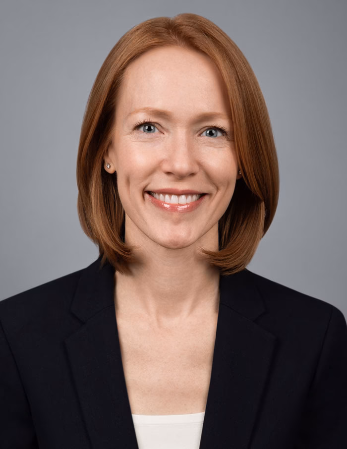 Confident studio portrait for finance executive