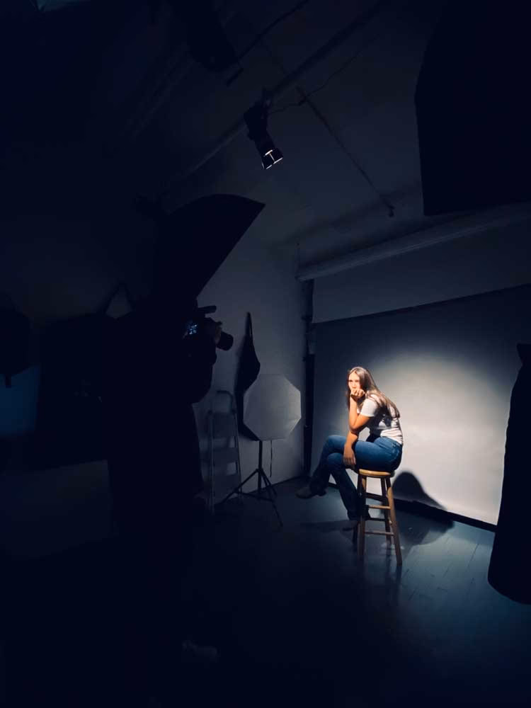 Photo Studio 308’s bright daylight setup with floor-to-ceiling windows and clean, minimalist aesthetic.