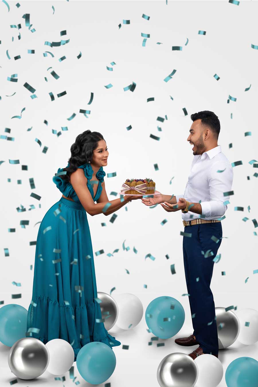 Professional birthday cake photoshoot with balloons and creative studio setup
